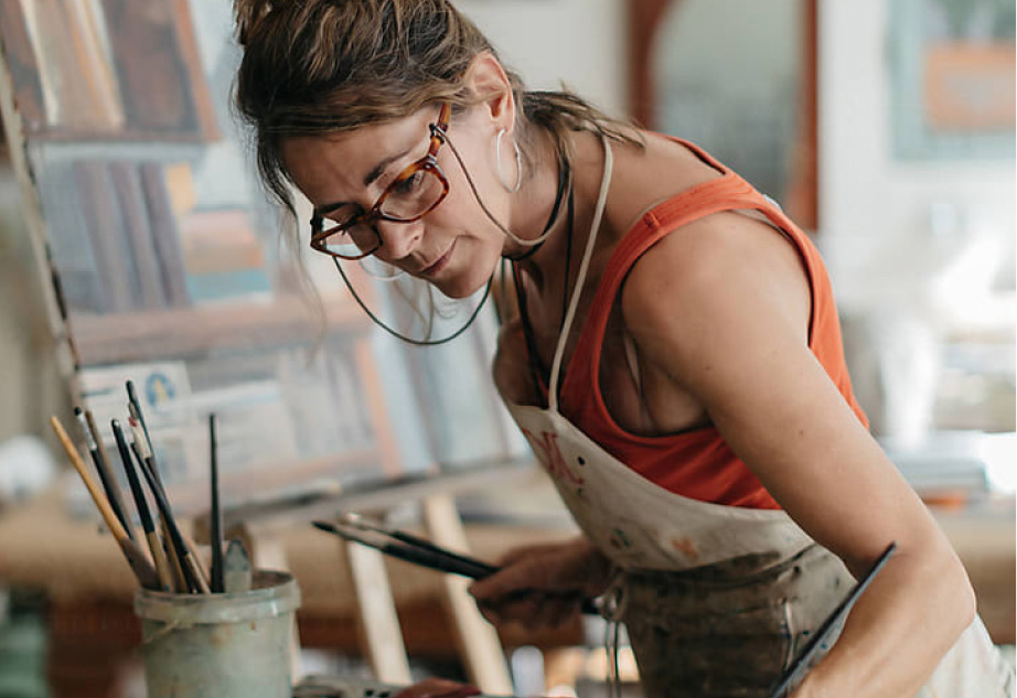 Smiling woman wearing new eyeglasses after using her VSP Individual Vision Plan benefits to save on eyewear.
